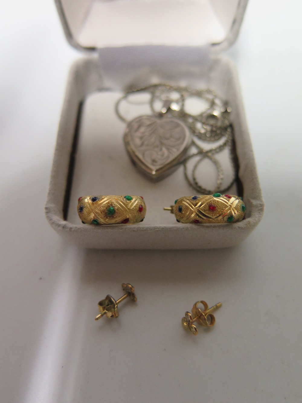 A Pair of 14 K Gold Earrings 1.2g, silver heart locket and other jewellery