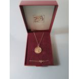 A 9 ct Gold St. Christopher Pendant on chain, .8 g