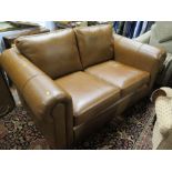 A Two Seater Brown Leather Sofa