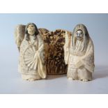 A Pair of Japanese Meiji Period Carved Ivory Netsuke with two faces and piece of antler