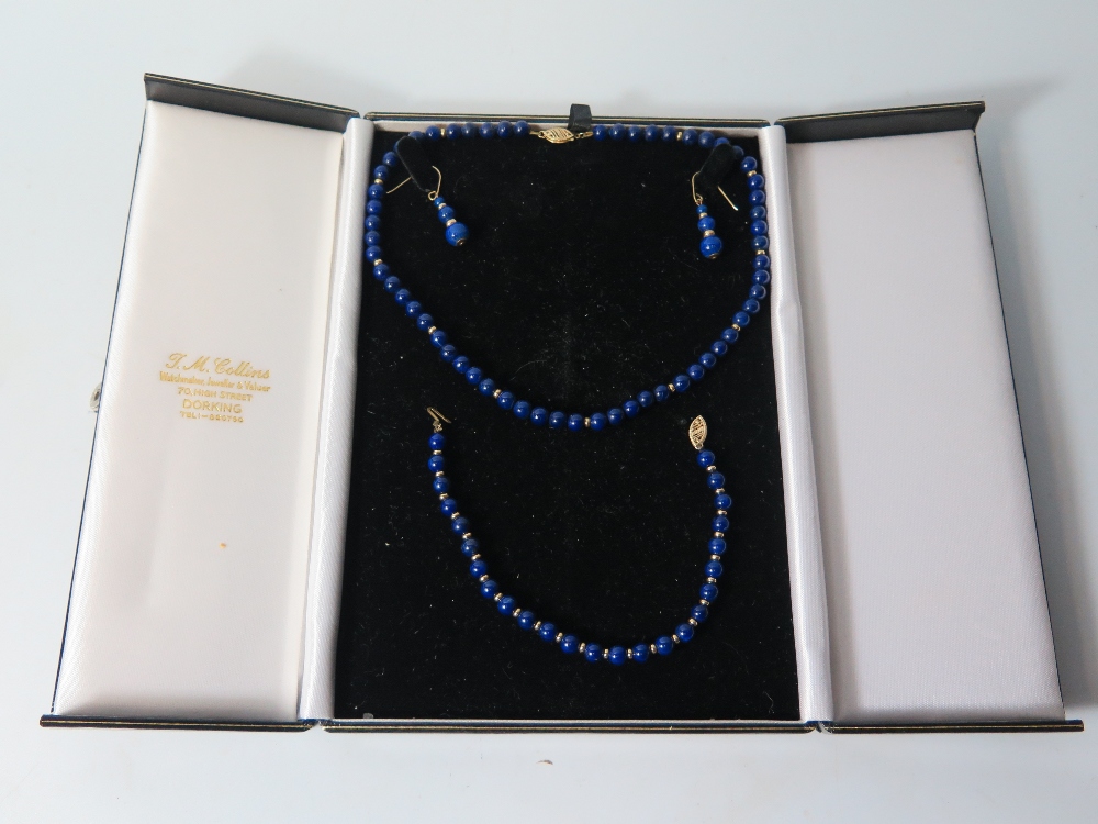 A 9 ct Gold and Lapis Lazuli Necklace with matching earrings and bracelet