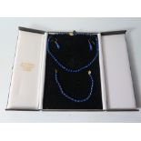 A 9 ct Gold and Lapis Lazuli Necklace with matching earrings and bracelet