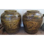 A Large Pair of Chinese Glazed Garden Pots decorated with dragons and flowers, 74 cm high