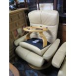 A Large Ekornes Cream Leather Reclining Armchair with footstool