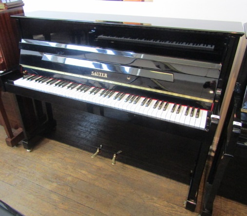 Sauter A Model 112 upright piano in an ebonised case. AMENDMENT Is a Model 108.