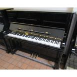 Schimmel (c1995) A traditional Model 128 upright piano in a bright ebonised case.