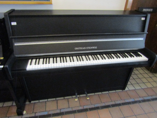 Grotrian Steinweg (2011) A Model 116 upright piano in a satin ebonised case.