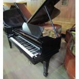 Steinway (c1920) A 5ft 10 in Model O grand piano in a bright ebonised case on square tapered legs.