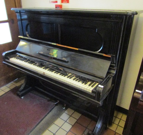 Steinway (c1886) An upright piano in an ebonised case.