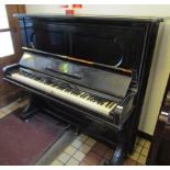 Steinway (c1886) An upright piano in an ebonised case.