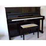 Yamaha (c1988) A Model SU118 upright piano in a bright ebonised case;