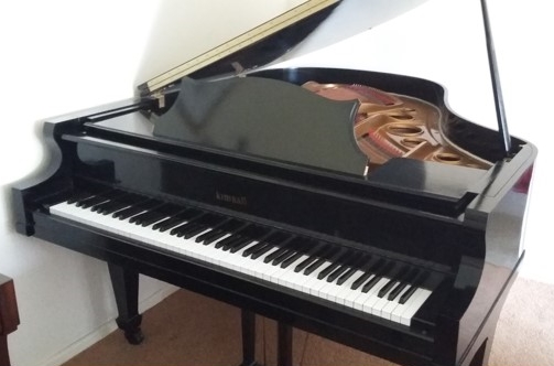 Kimball (c1973) A 5ft 8in grand piano in a bright ebonised case. AMENDMENT to estimate.