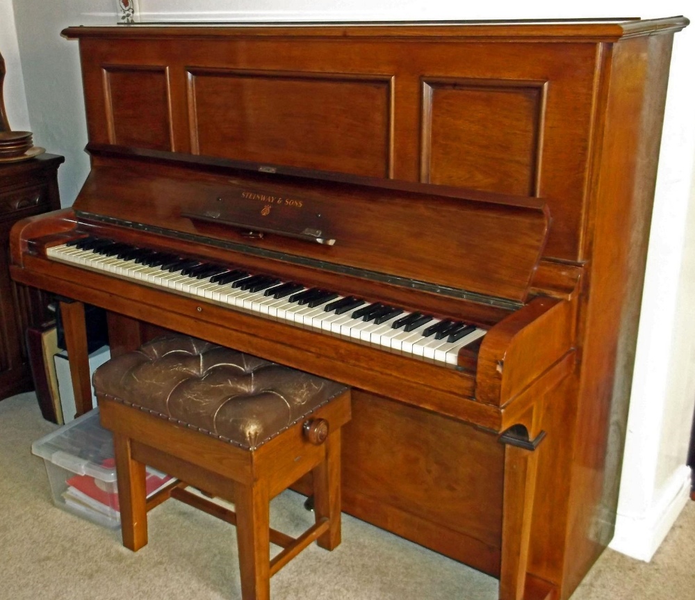 Steinway (c1924) A Model K upright piano in a mahogany case; together with an adjustable stool.