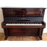 Steinway (c1900) An upright piano in a mahogany case.