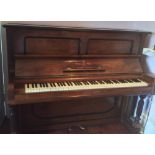 Steinway (c1903) An upright piano in a rosewood case with turned fluted front supports.