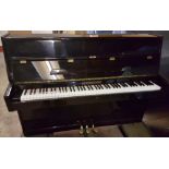 Osztreicher A recent upright piano in a modern style bright ebonised case. LATE ENTRY.