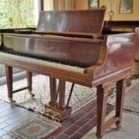 Steinway (c1900) A grand piano in a mahogany and satinwood banded case raised on dual square