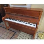 Feurich (c1989) A Model 115 upright piano in a satin walnut case.