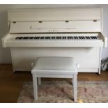 Kawai (c2012) A Model K-15E upright piano in a bright white case, together with a matching stool.