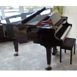 Baldwin (c1995) A 5ft 1in grand piano in a bright ebonised case on square tapered legs;