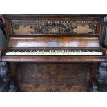 Robert Cocks & Co London A 19th century upright piano in a walnut case with carved cabriole