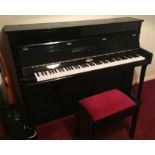 Kemble (c2004) A traditional style upright piano in a bright ebonised case;