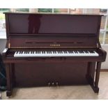 Yamaha (c2004) A Model U3SN upright piano in a bright mahogany case; together with a stool.