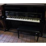 Yamaha (c2005) A traditional style Model T116 upright piano in a bright ebonised case,