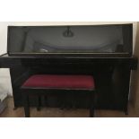 Yamaha (c1987) A Model E108 upright piano in a bright ebonised case;