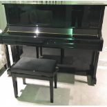 Yamaha (c2010) A Model U1 upright piano in a bright ebonised case; together with a matching stool.