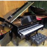 Kawai (c1981) A 6ft 1in grand piano in a bright ebonised case on square tapered legs;