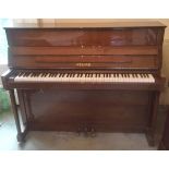 Welmar (c1987) A traditional style upright piano in a bright mahogany case.