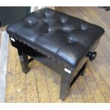 Piano Stool A concert adjustable stool in an ebonised finish with a button leather top.