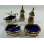 A five piece silver cruet, Birmingham 1942, comprised of two salts and a mustard pot,