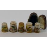 Five late 19th and early 20th century century porcelain thimbles hand painted with birds to include