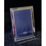 A plain rectangular silver photograph frame, Sheffield 1996 by Richard Carr,