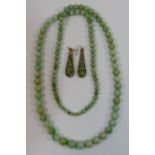 A string of graduated jadeite beads, the largest bead 9.7mm diameter, 67.