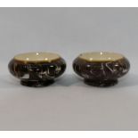 A pair of Moorcroft MacIntyre pottery salts with brown marbled glaze, 5.