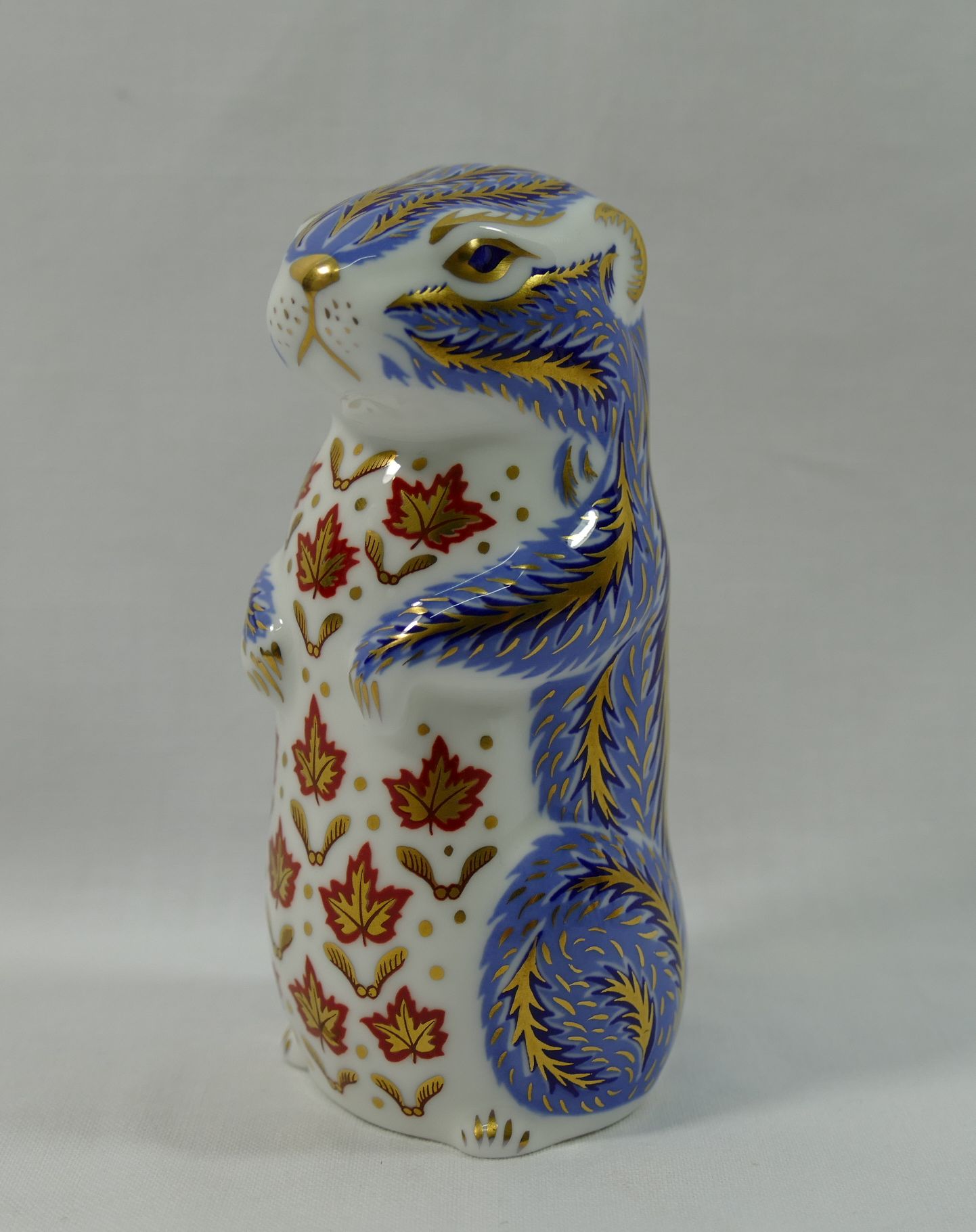 A Royal Crown Derby squirrel paperweight with gold stopper, dated 2013, 10.