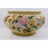 A Zsolnay oval jardinere, with yellow ground, hand painted in enamels with flowers,