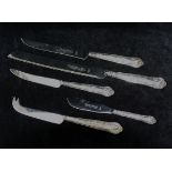 Five silver handled kings pattern flatware items, comprised of a bread knife, cake knife,