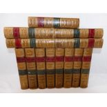 Thirteen half calf bound volumes containing the works of Charles Dickens,