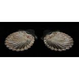 A pair of Victorian silver shell shaped butter dishes,