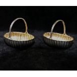 A pair of small Victorian silver oval baskets, Birmingham 1887,