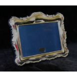 A decorative silver photograph frame, Sheffield 1996 by Richard Carr, 19.2cm x 15.