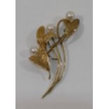 A 9 carat gold and cultured pearl brooch, of foliate design, with import marks for London 1969, 5.