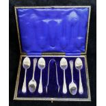 A set of six Edwardian silver coffee spoons, London 1908, and a pair of matching sugar tongs,