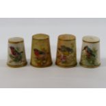 A Victorian Royal Worcester porcelain thimble, hand painted with a bird,