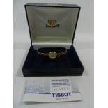 A ladies 9 carat gold Tissot bracelet watch, the case and strap stamped '375',