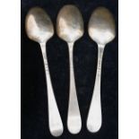 A pair of George III silver table spoons, the bowls with floral scroll backs, London,